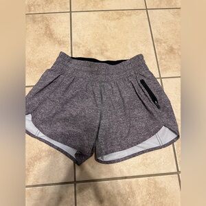 Lululemon Tracker Short V (4"') in the color Heather Lux Multi Black. Size 6